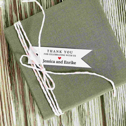 Personalized thank you for celebrating with us wedding favor tags with names and red heart.