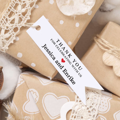 Personalized thank you for celebrating with us wedding favor tags with names and red heart.