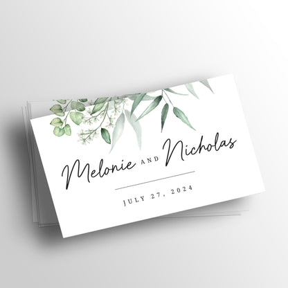 Custom wedding website cards from XOXOKristen, featuring a greenery design with elegant floral elements and a QR code for easy website access.